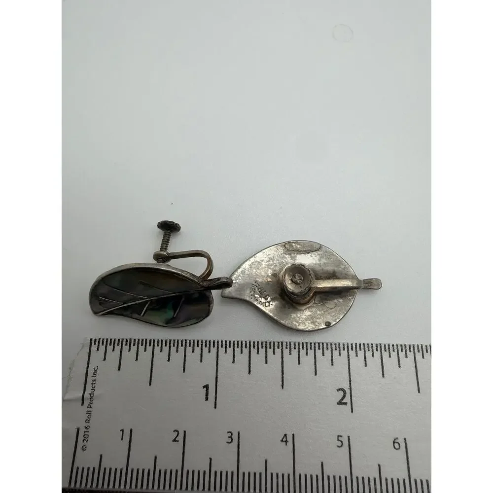 vintage Mexican sterling silver earrings feature a leaf design inlaid